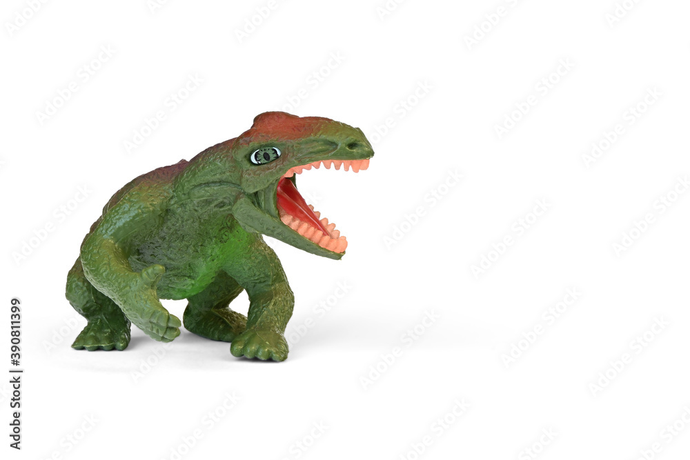 Fototapeta premium Dinosaur plastic toy. Children's toy, animal figure isolated on white background with copy space.