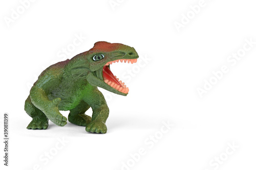 Dinosaur plastic toy. Children s toy  animal figure isolated on white background with copy space.