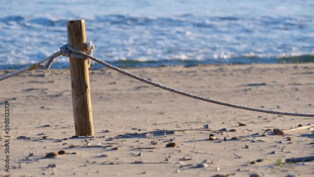 Boundary Fence Examples Rope Rope boundary fences protecting dune system on spanish beach. Sandy sea ...