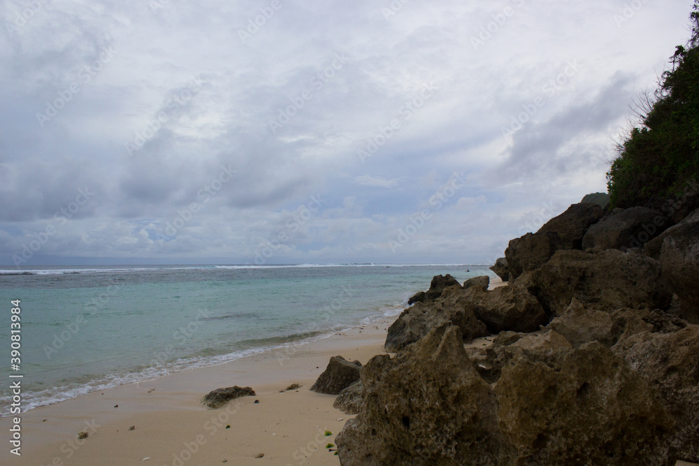 coral rocks and green hills in the beach area
