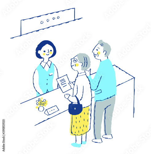 受付窓口　受付係の女性とシニア夫婦