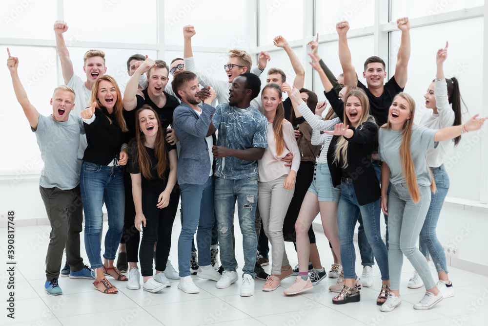 Fototapeta premium team of happy young people showing their success