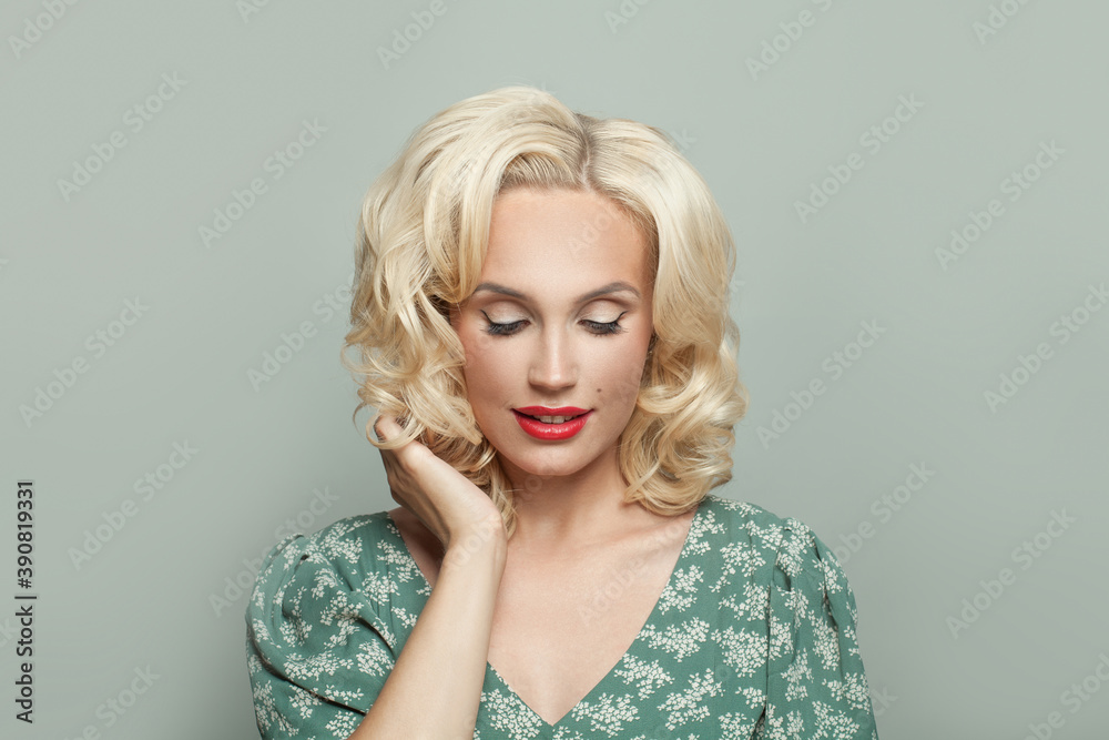 Blonde woman with makeup on light green background Blonde woman with makeup on light green background