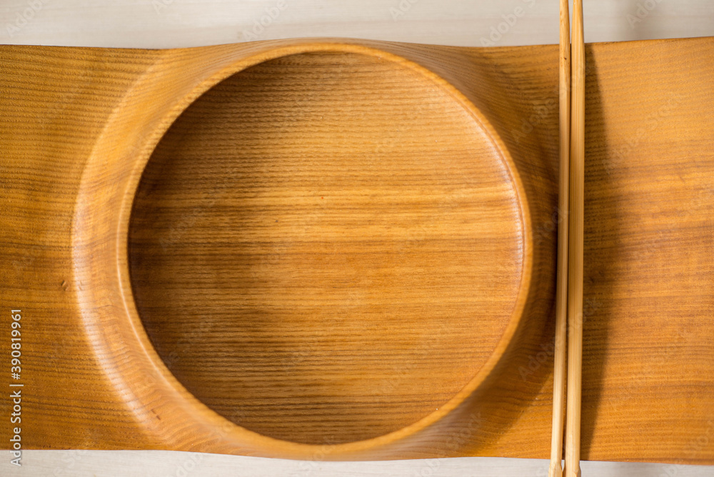 Wooden plate for sushi. Craft Japanese tableware. Exclusive handmade bowl with wood texture Wooden plate for sushi. Craft Japanese tableware. Exclusive handmade bowl with wood texture