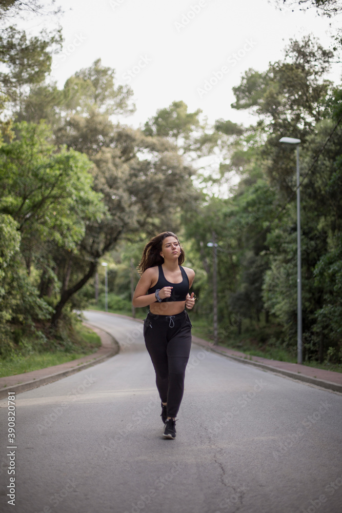 Woman running outdoors Woman running outdoors