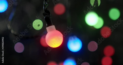 The lights of the Christmas garland sparkle brightly. 