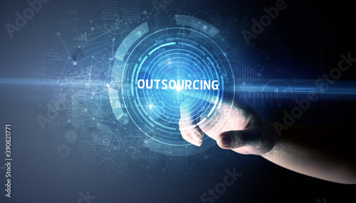 Hand touching OUTSOURCING button, modern business technology concept