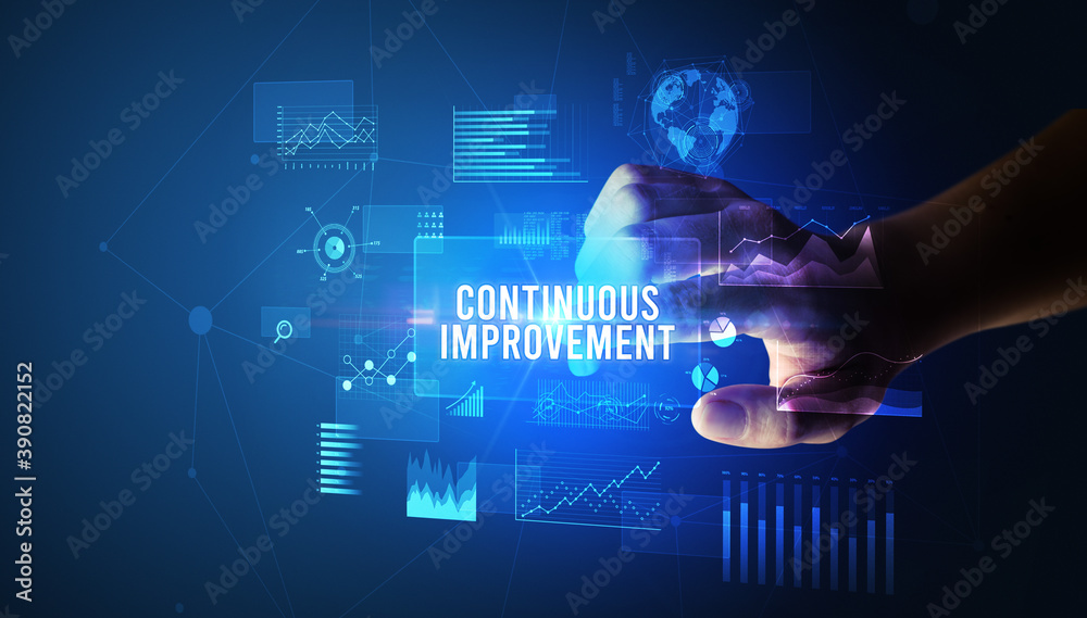 Hand touching CONTINUOUS IMPROVEMENT inscription, new business technology concept Hand touching CONTINUOUS IMPROVEMENT inscription, new business technology concept