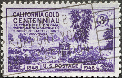USA - Circa 1948 : a postage stamp printed in the US showing the famous Sutter’s Mill in Coloma. during the California Gold Rush Centennial photo