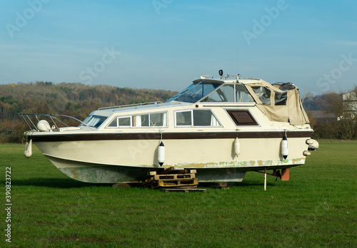 Old river cruiser boat in a field © simonXT2