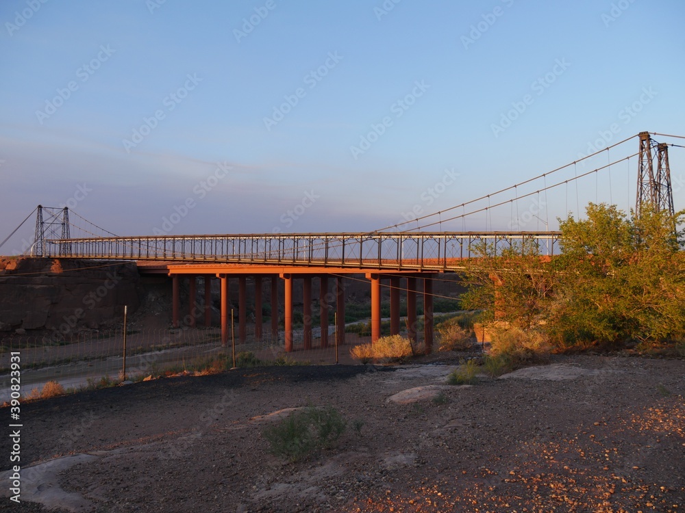 Fototapeta premium Wide shot of the historic Tanner's Crossing Bridge over Little Colorado River at Cameron, Arizona.