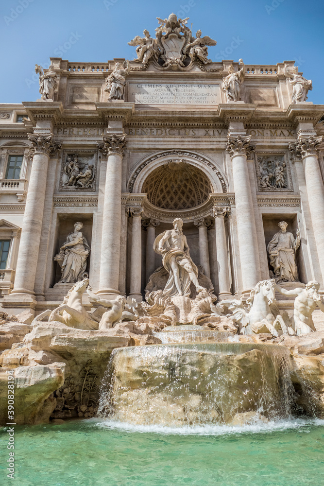 The famous Fountain of Trevi in Rome with blue sky