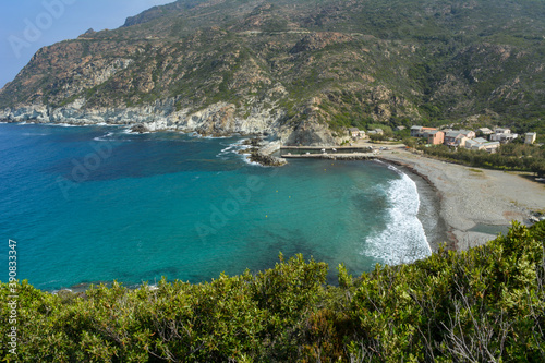 Fototapeta Naklejka Na Ścianę i Meble -  Aerial view of Marine di Giottani, one of the most remote beaches of the western side of Cap Corse, the northern peninsula of the island famous for its wild landscape. Corsica, France 