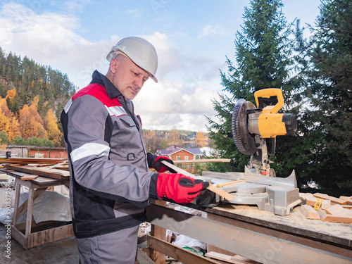 Man is engaged in wood proc...