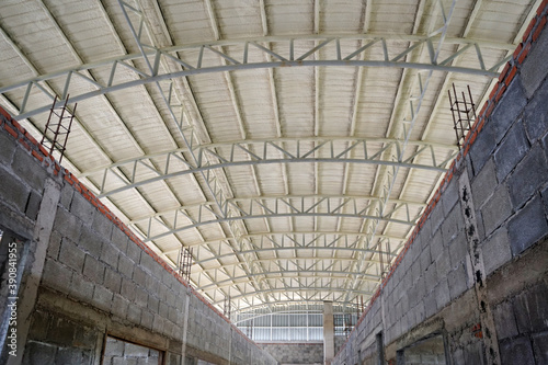 The roof of the building is coated with PU Foam. Construction site.