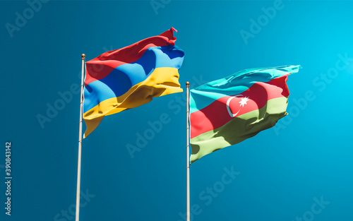 Beautiful national state flags of Azerbaijan and Armenia together at the sky background. 3D artwork concept.