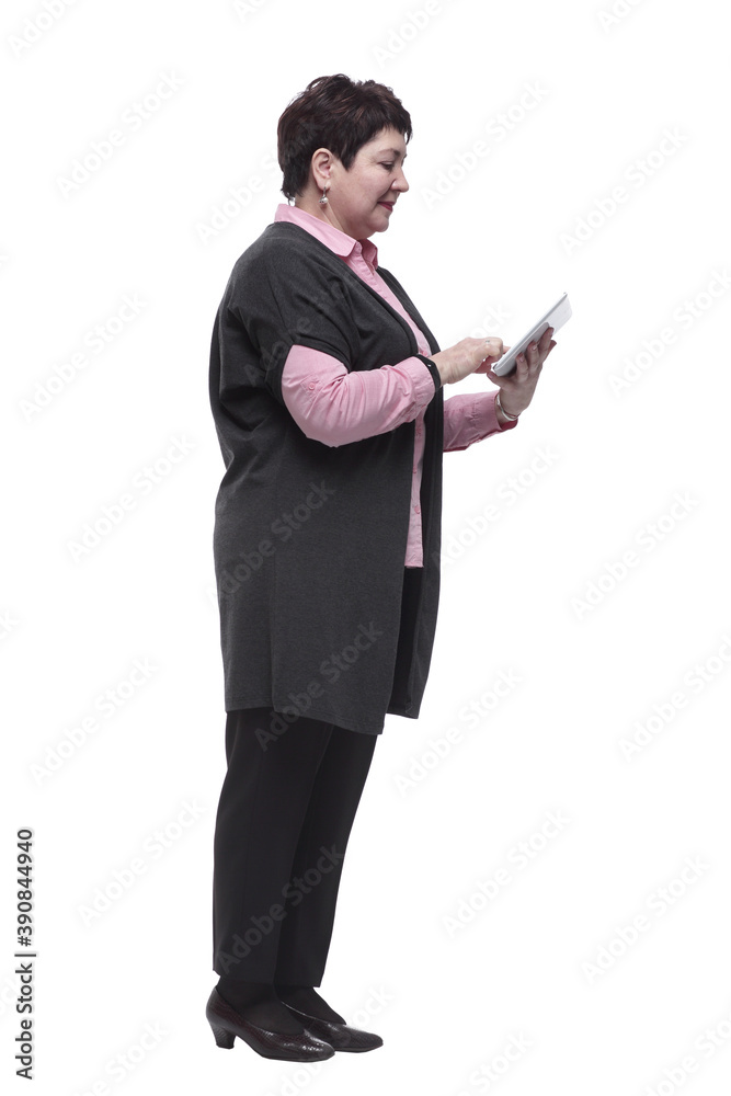 side view . adult woman using a digital tablet side view . adult woman using a digital tablet