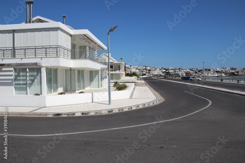 Bright white buildings in Yzerfontein. By the shore of the Atlantic Ocean, on the west coast of South Africa. photo