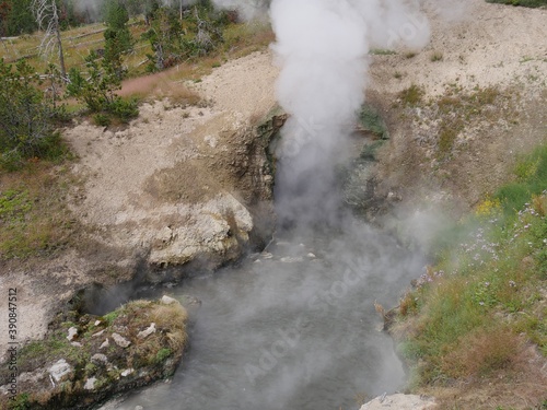 Close cropped shot of the mouth of the Dragon's Mouth spewing out hot steam at Yellowstone National Park. © raksyBH