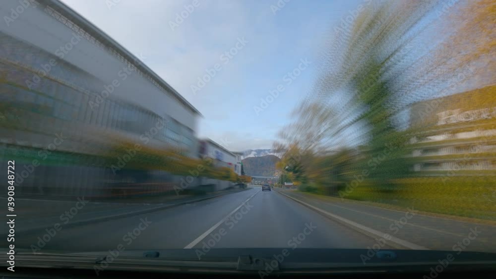Sped up POV point of view dashcam dash camera driving around lake Bled, Slovenia. Motion blur effect. Famous landmark and tourist lake in Europe. Wide angle, forward dolly moving, real time