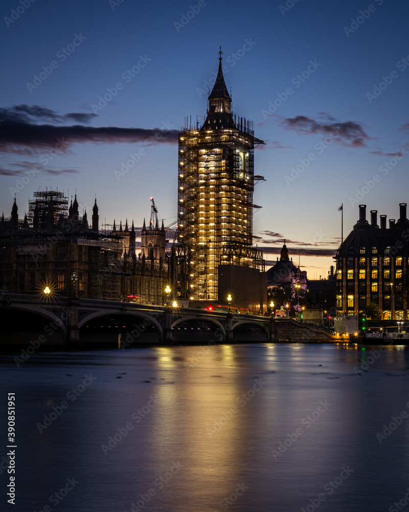 Fototapeta premium Big Ben clock tower under scaffolding at sunset