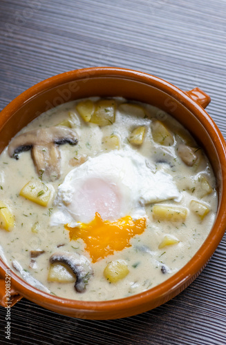 dill soup with poached egg photo