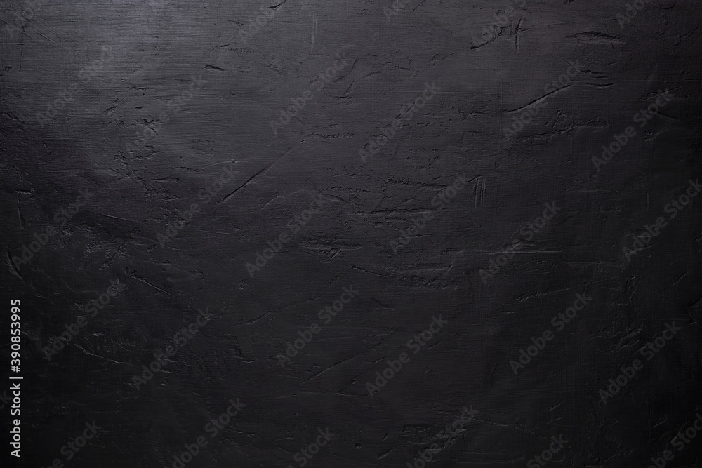 Top view of black stone pattern, background with scratches and dents with copy space for text or any design Top view of black stone pattern, background with scratches and dents with copy space for text or any design