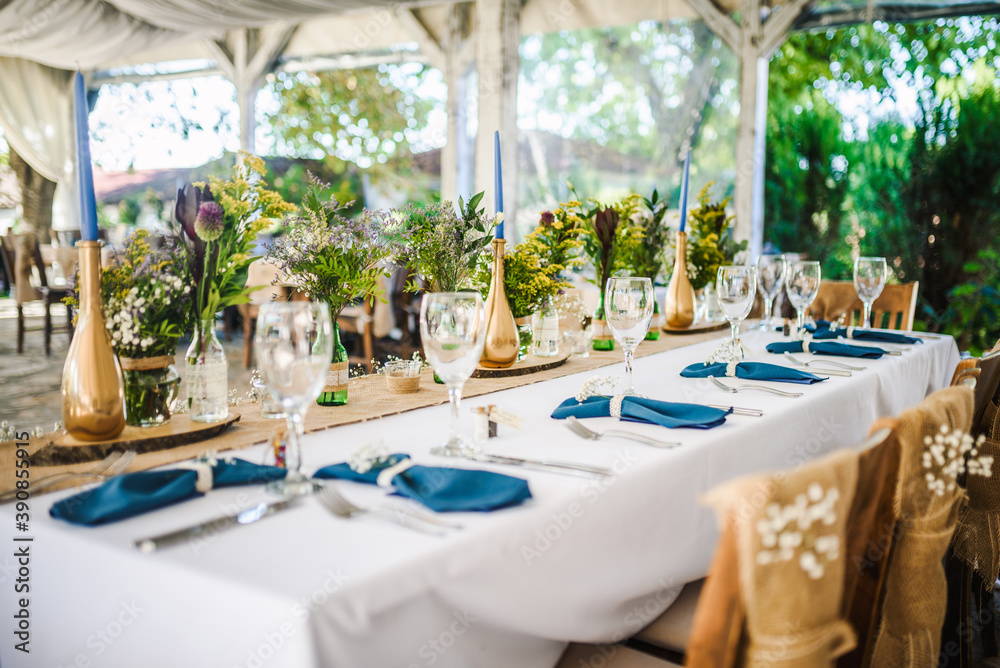 Table decoration for a special occasion -  boho wedding table set up. Outdoor wedding/party