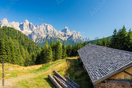 Hut in the mountains with the dolomite Peaks of Pale di San Martino in the background - Trentino, Italy