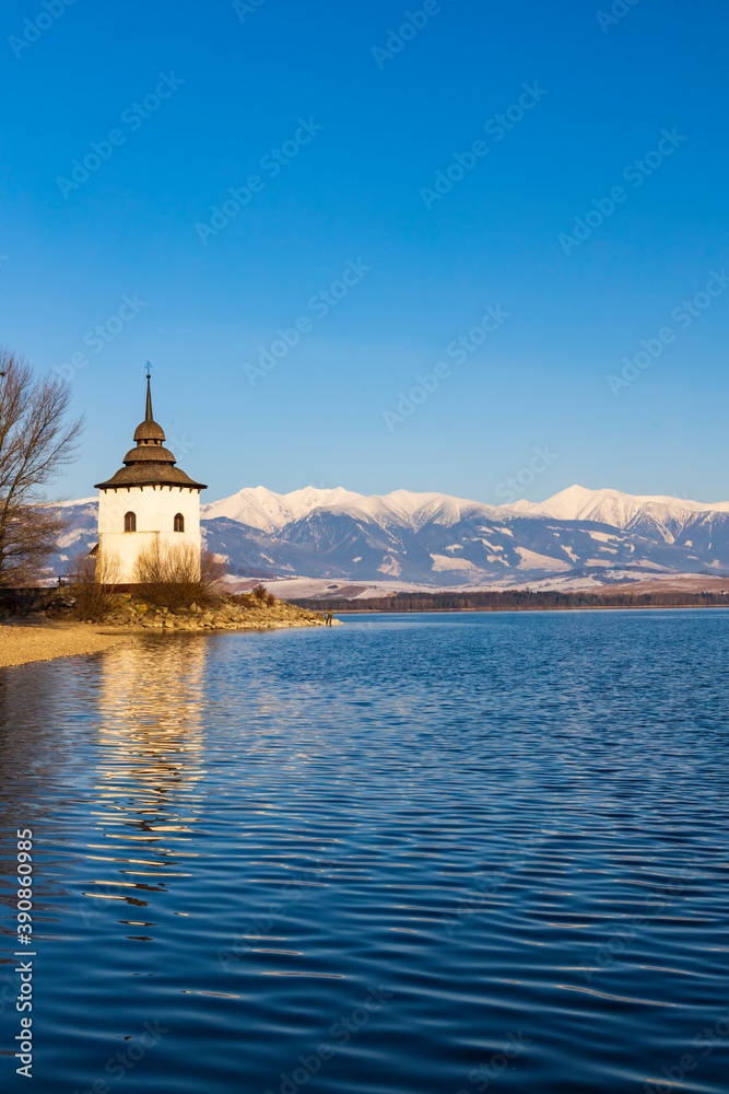 Church of Virgin Mary in Havranok and lake Liptovska Mara, district Liptovsky Mikulas, Slovakia