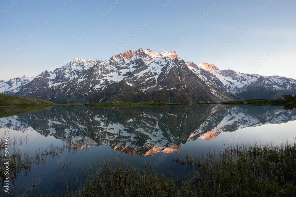 Reflection of the mountain La Meije on Lac Pontet in the Hautes Alpes department in the French Alps