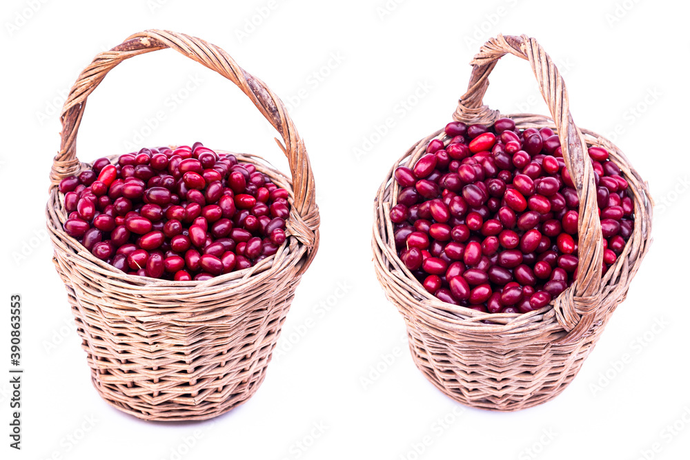 Fresh cornel berries. Fresh dogwood red berries with green leafs in wooden basket isolated on white background. Fresh cornel berries. Fresh dogwood red berries with green leafs in wooden basket isolated on white background.