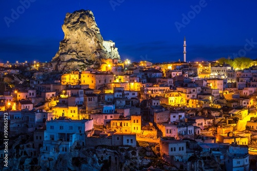 Beautiful night view of Ortahisar in Cappadocia, Turkey and amazing ancient jagged castle which was opened to the public in 2013 after extensive renovations. Tower is on the right. 