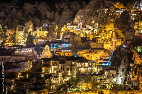 Beautifully illuminated at night buildings of Gorme, city built among rock formations. Cappadocia, Turkey. It has been voted one of the most beautiful villages in world by several travel magazines.