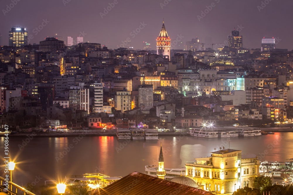 View of night Istambul and Galata Tower, a medieval stone tower. There is a restaurant and cafe on its upper floors which have views of Istanbul and the Bosphorus. Turkey.