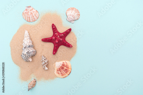 Holiday, summer vacation. Composition with sand and seashells, top view. Space for text. Layout for ideas.