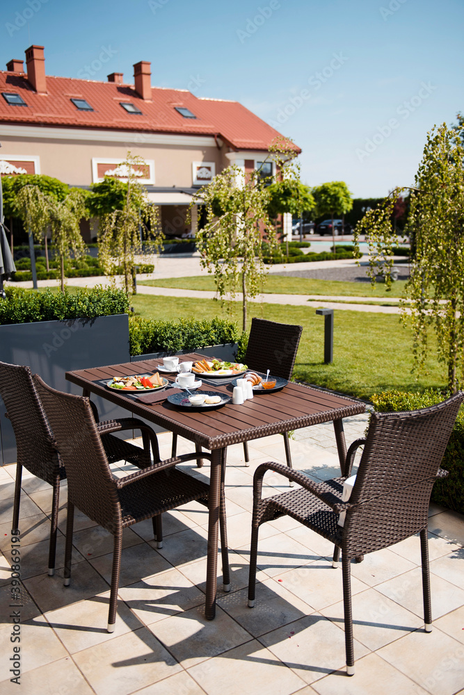 Fototapeta premium Tasty breakfast served for two persons outdoors