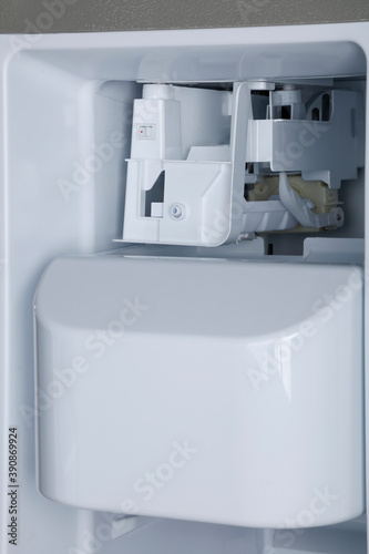 Closeup view of the home refrigerator 
ice maker