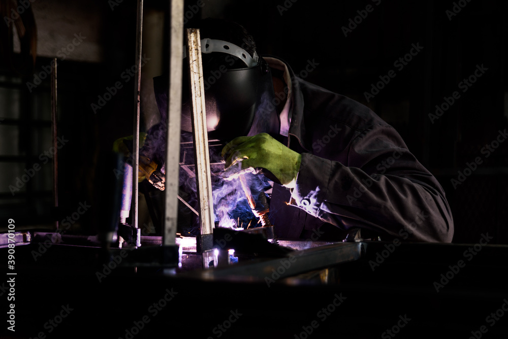 Blacksmith Forging Metal in Workshop