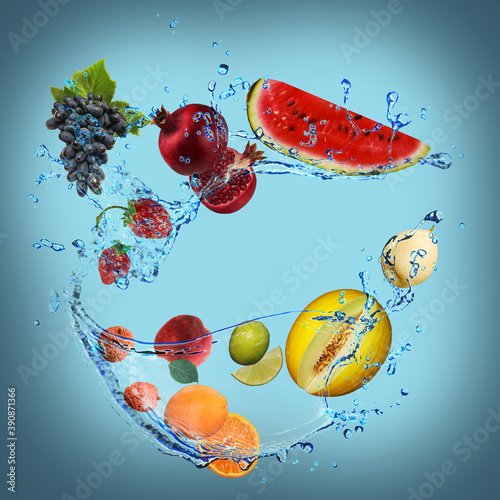 Fototapeta Naklejka Na Ścianę i Meble -  Panorama with fruits in splashes of water - juicy lemon, grapes, melon, banana, pomegranate, strawberry, lime, pear, peach are full of vitamins and are very beneficial for our health