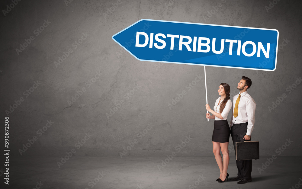 Young business person in casual holding road sign with DISTRIBUTION inscription, new business direction concept Young business person in casual holding road sign with DISTRIBUTION inscription, new business direction concept