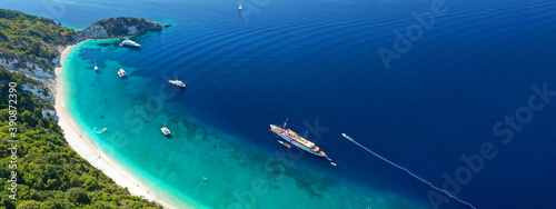 Fototapeta Naklejka Na Ścianę i Meble -  Aerial drone top down ultra wide photo of luxury yacht anchored in tropical exotic island turquoise sea