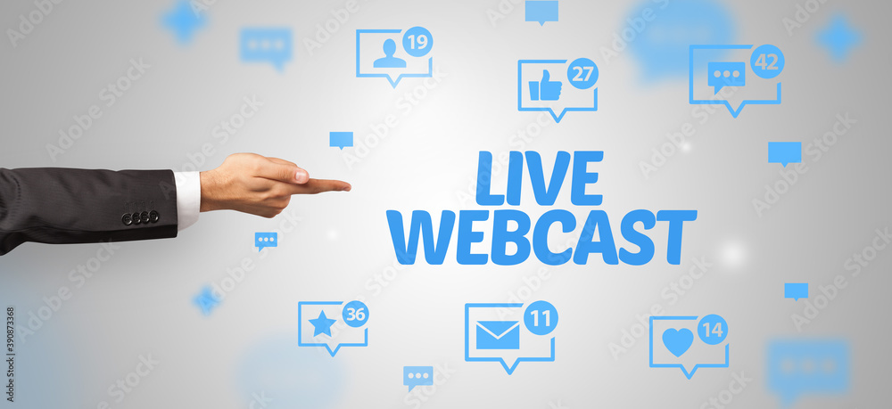 Close-Up of cropped hand pointing at LIVE WEBCAST inscription, social networking concept Close-Up of cropped hand pointing at LIVE WEBCAST inscription, social networking concept