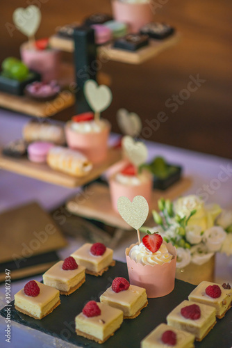 sweet dessert with cream and heart on candy bar, product photography for patisserie or restaurant © martingaal