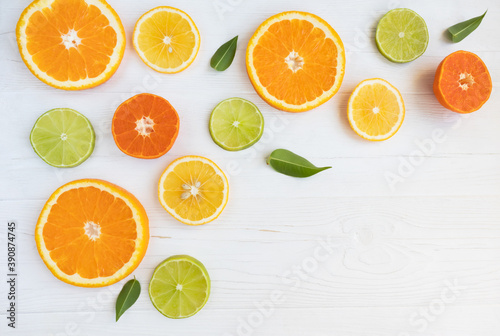 Lemons  lime  orange and grapefruit cut in circles on a white background with space for text. Poster  banner  article.