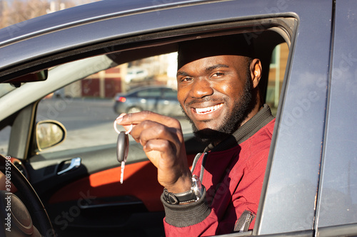 Happy African American with car key