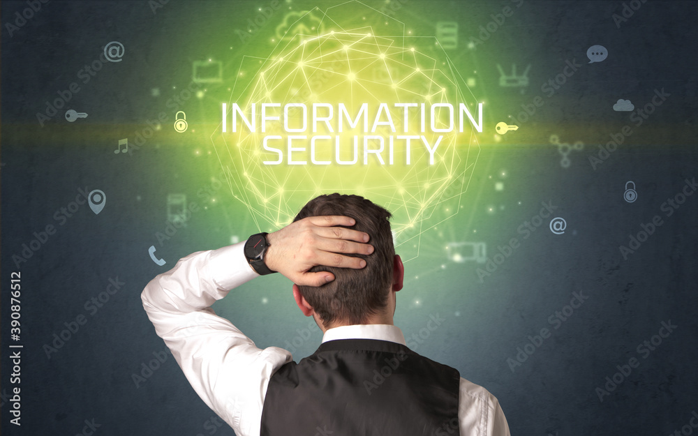 Rear view of a businessman with INFORMATION SECURITY inscription, online security concept Rear view of a businessman with INFORMATION SECURITY inscription, online security concept