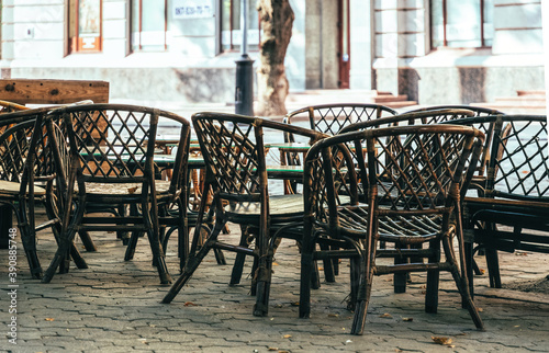 Closed sidewalk cafe and deserted morning street of the ancient city 