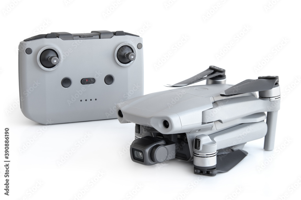 Gray colour drone with a remote control on a white background Gray colour drone with a remote control on a white background