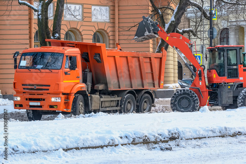 Snow removal in the city with special equipment and people.